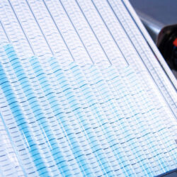 Armfield manometer displaying a series of blue lines on a graph paper.